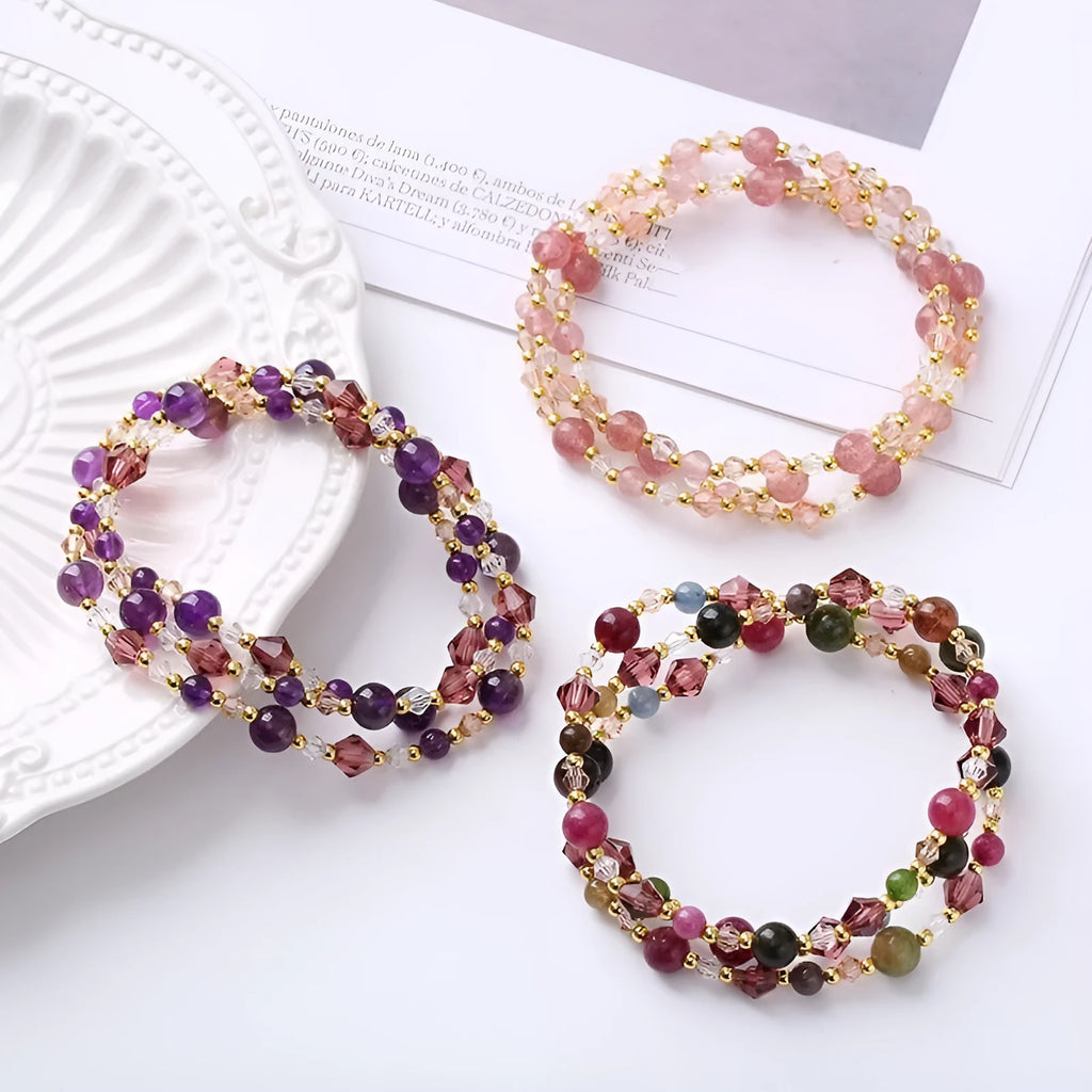 Women's handmade adjustable bracelet with tourmaline, strawberry quartz, and amethyst crystals