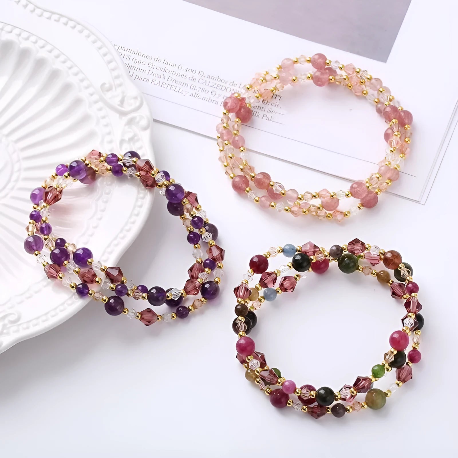 Women's handmade adjustable bracelet with tourmaline, strawberry quartz, and amethyst crystals