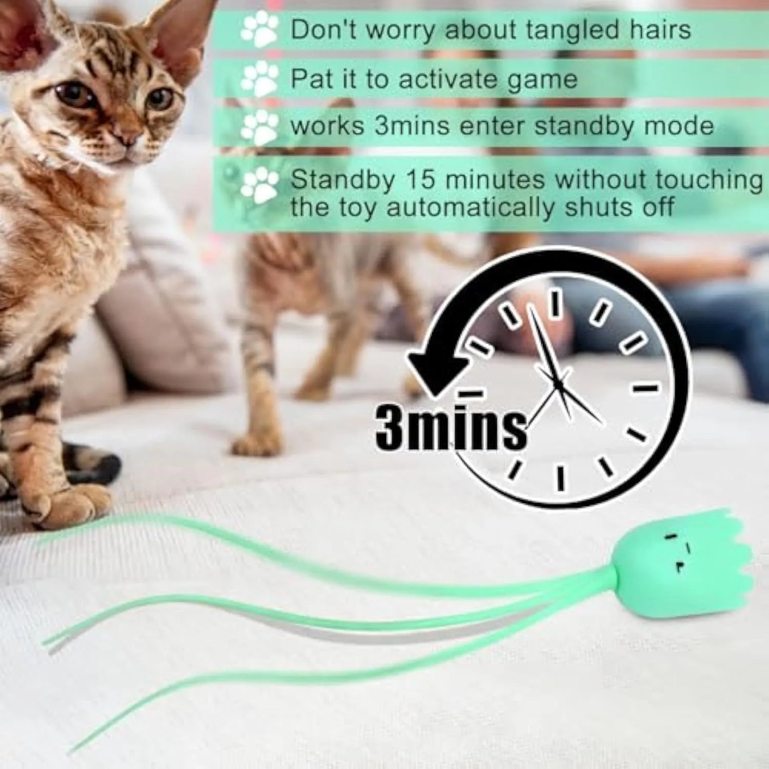 Green automatic cat wand toy with swinging silicone tails on wooden floor
