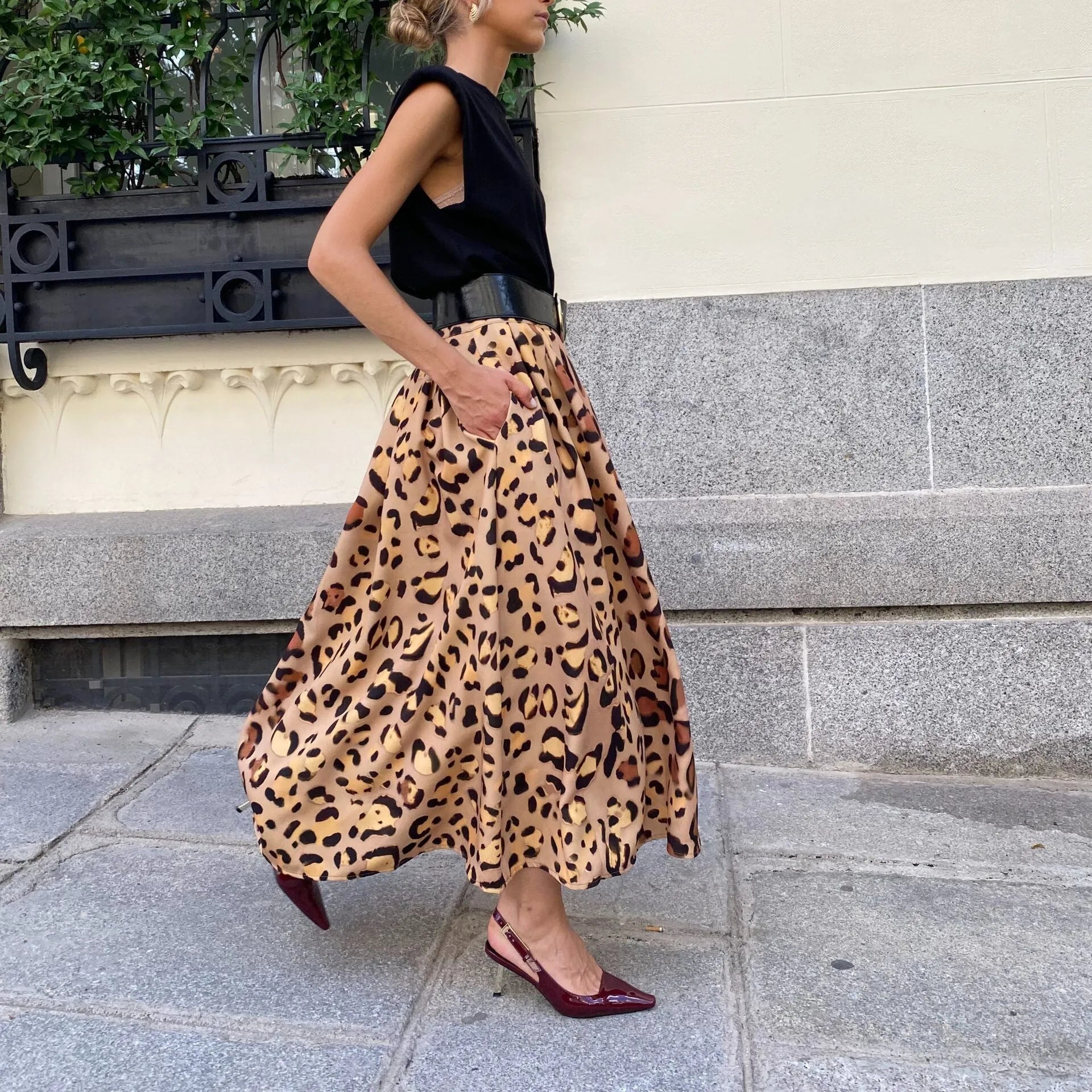 Women's brown leopard print A-line skirt with big hem in polyester fabric