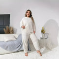 Women's creamy white plush polyester two-piece tracksuit set with crew neck top and matching trousers