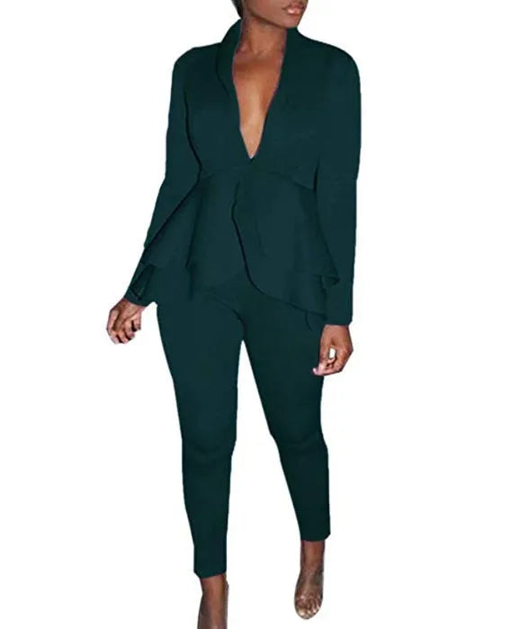 White ruffled business casual shirt and matching pencil pants set laid flat.