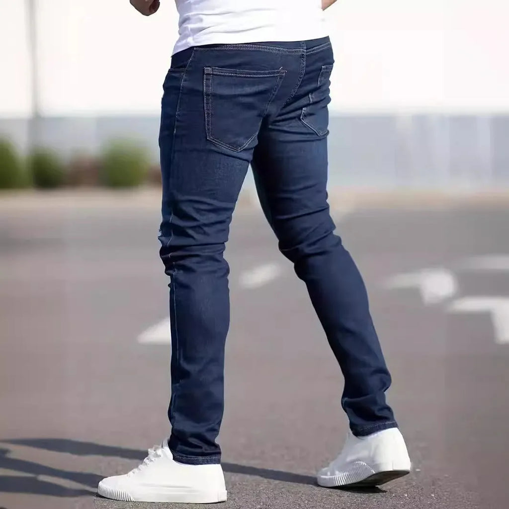 Men's dark blue skinny jeans with medium stretch cotton fabric and zipper fly
