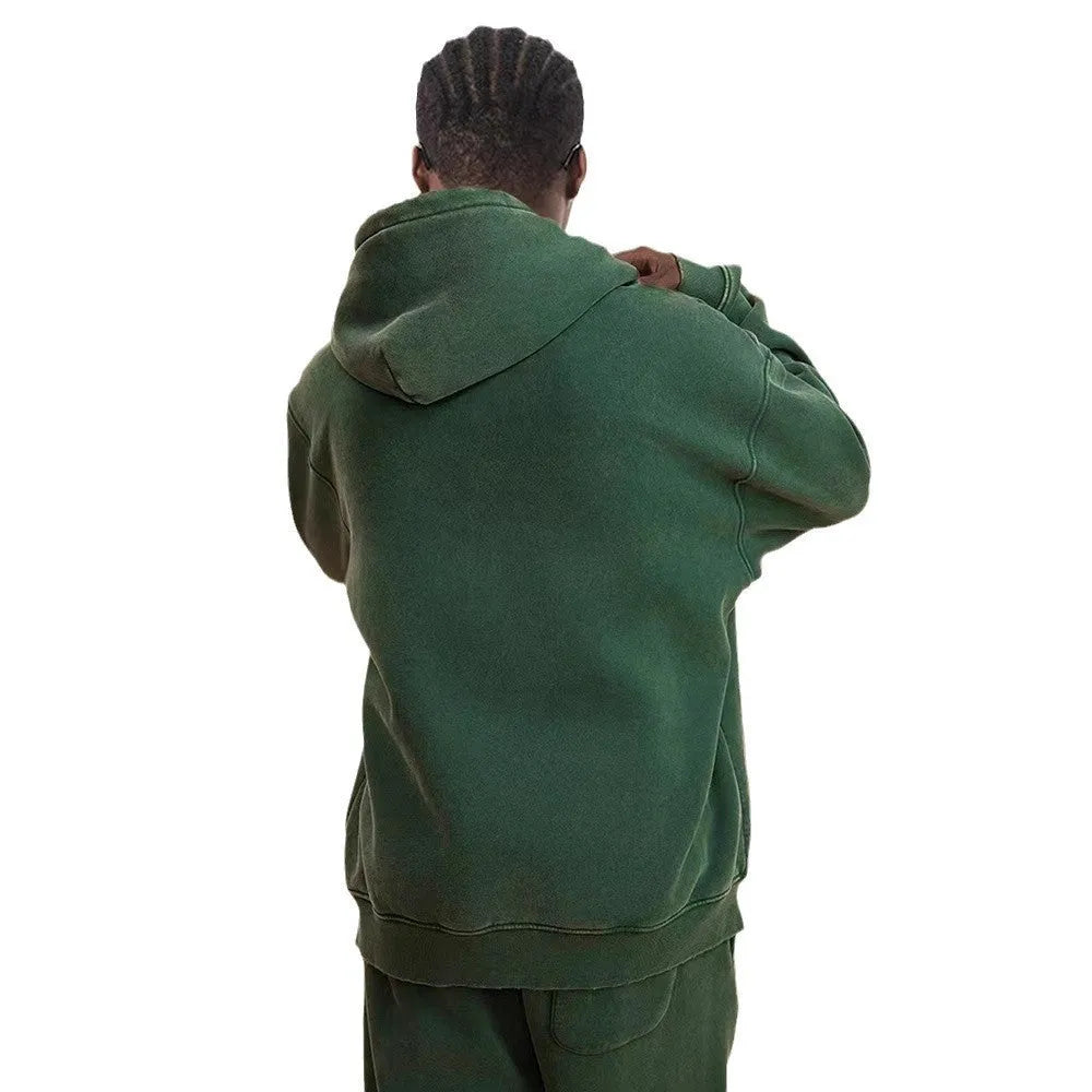 Man's washed cotton hooded cardigan with fleece lining and a double front zipper.