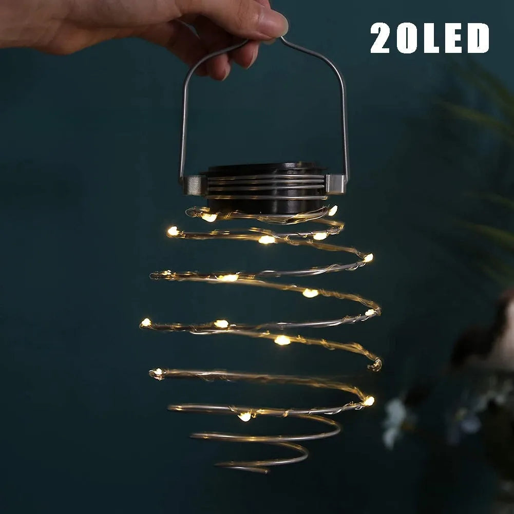 Solar spiral iron lamp with pineapple decoration, IP44 rated for outdoor garden or courtyard use