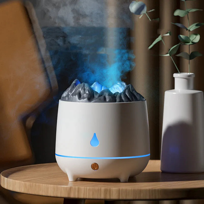 Black volcano-shaped ultrasonic humidifier and aroma diffuser with USB cable on a wooden table.