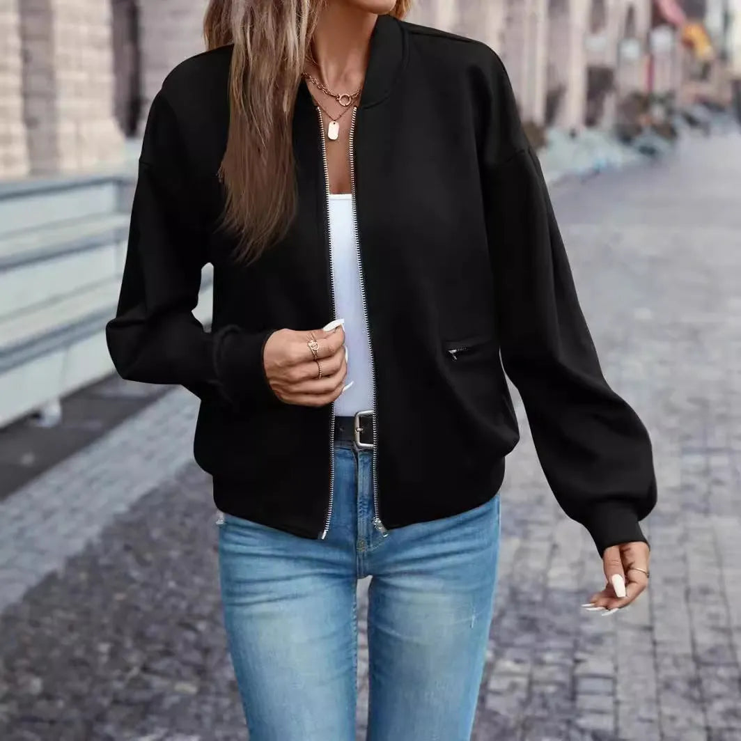 Black women's zip-front casual jacket with long sleeves on a hanger.