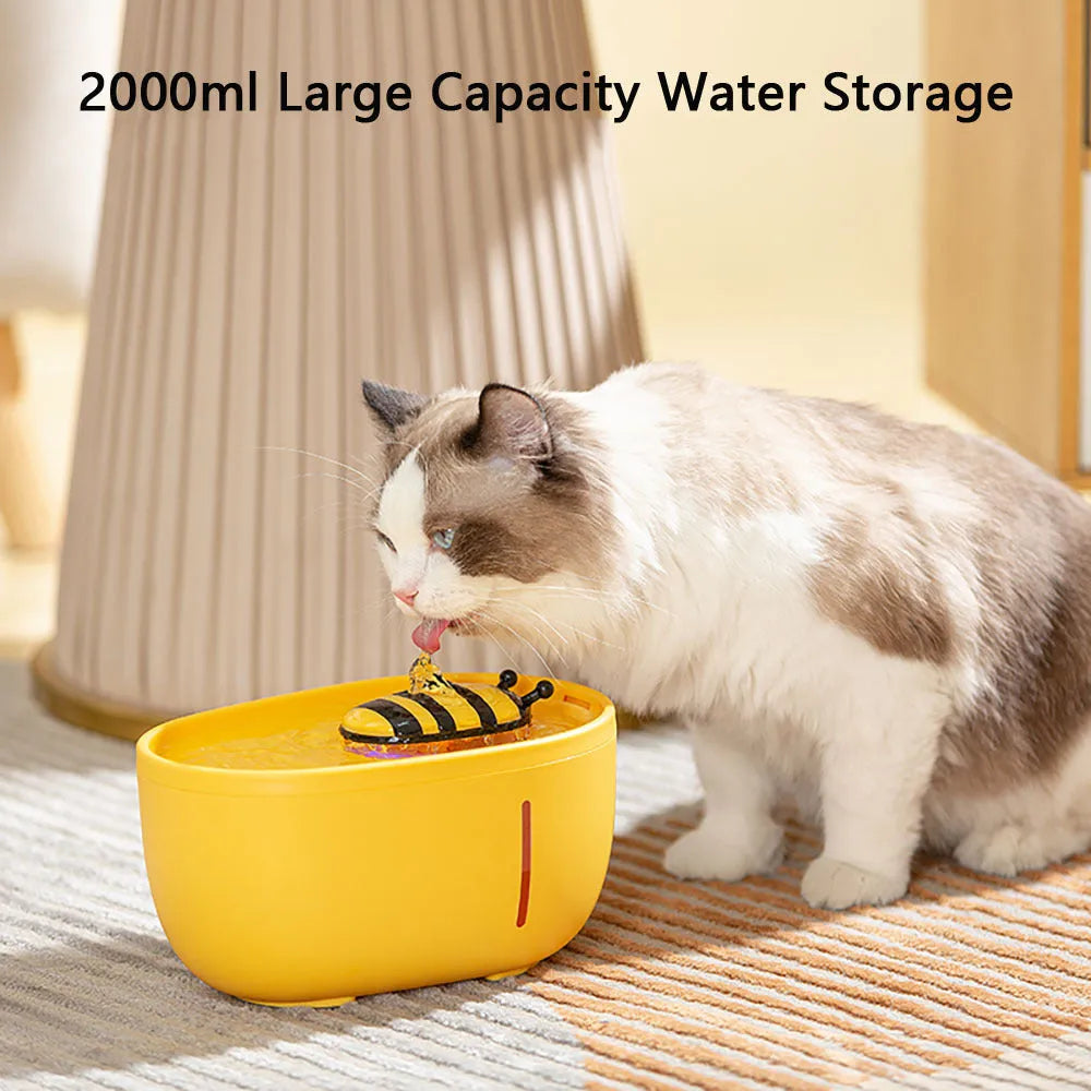 Yellow USB-powered cat water fountain with filter on anti-slip base.