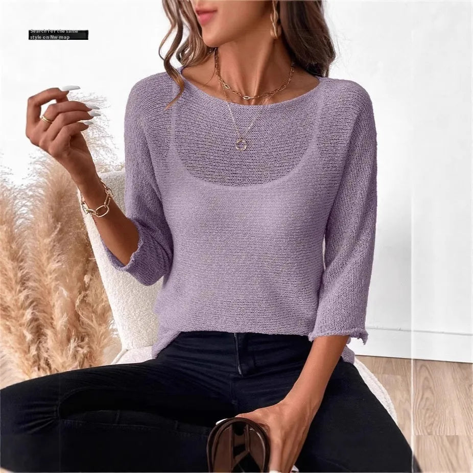 Women's off-shoulder knitted top in light blue with 3D pattern and 3/4 sleeves.