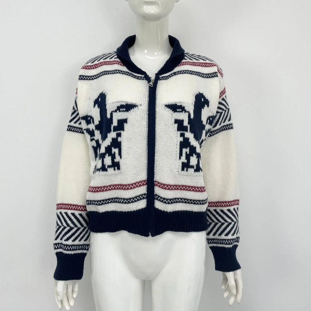 White women's cardigan with front zip, lapel collar, and jacquard contrast stripe pattern.