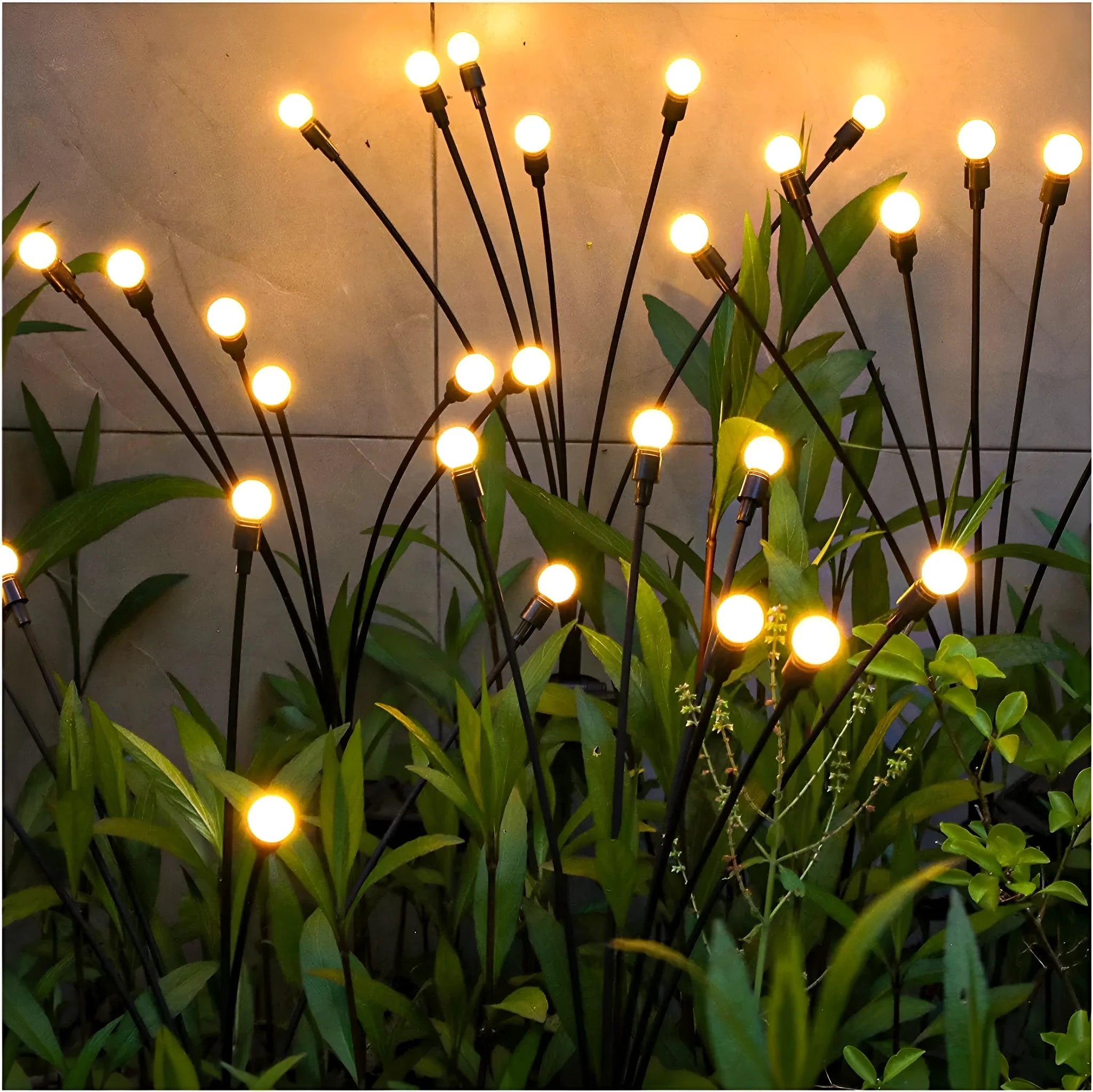 Solar-powered LED firefly ground lights with stainless steel stake for garden installation
