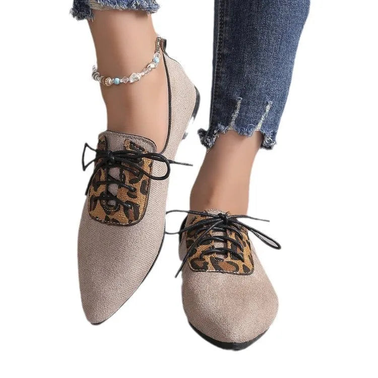 Beige leopard print women's pointed toe high heel pumps with a rubber sole.