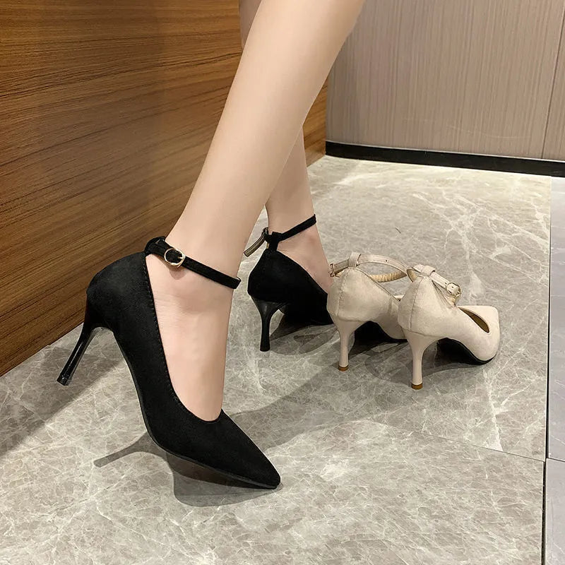 Women's black stiletto heel pump shoes with buckle detail and skull pattern