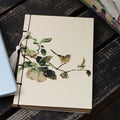 Retro antique wire-bound ledger notebook with embossed cowhide cover and decorative tassels