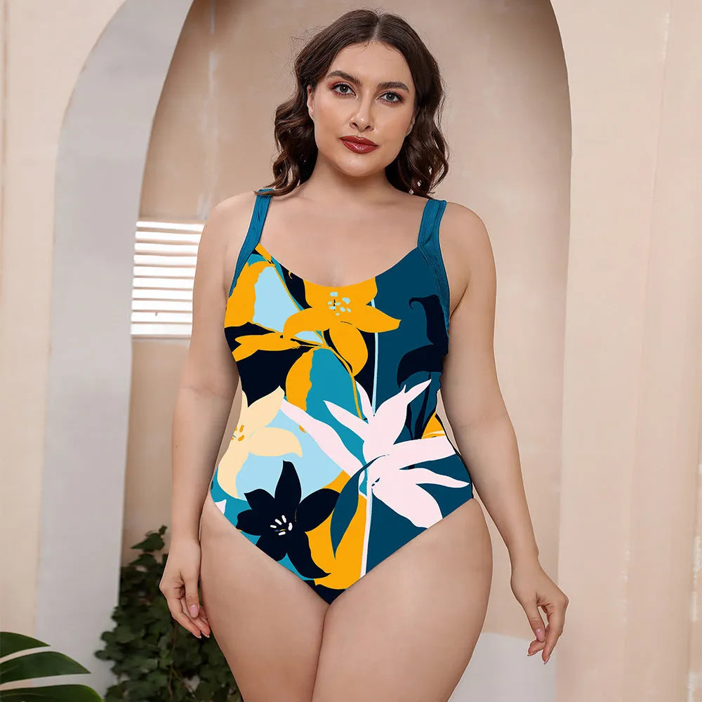Women's floral print conservative one-piece swimsuit with vest top and spaghetti straps.