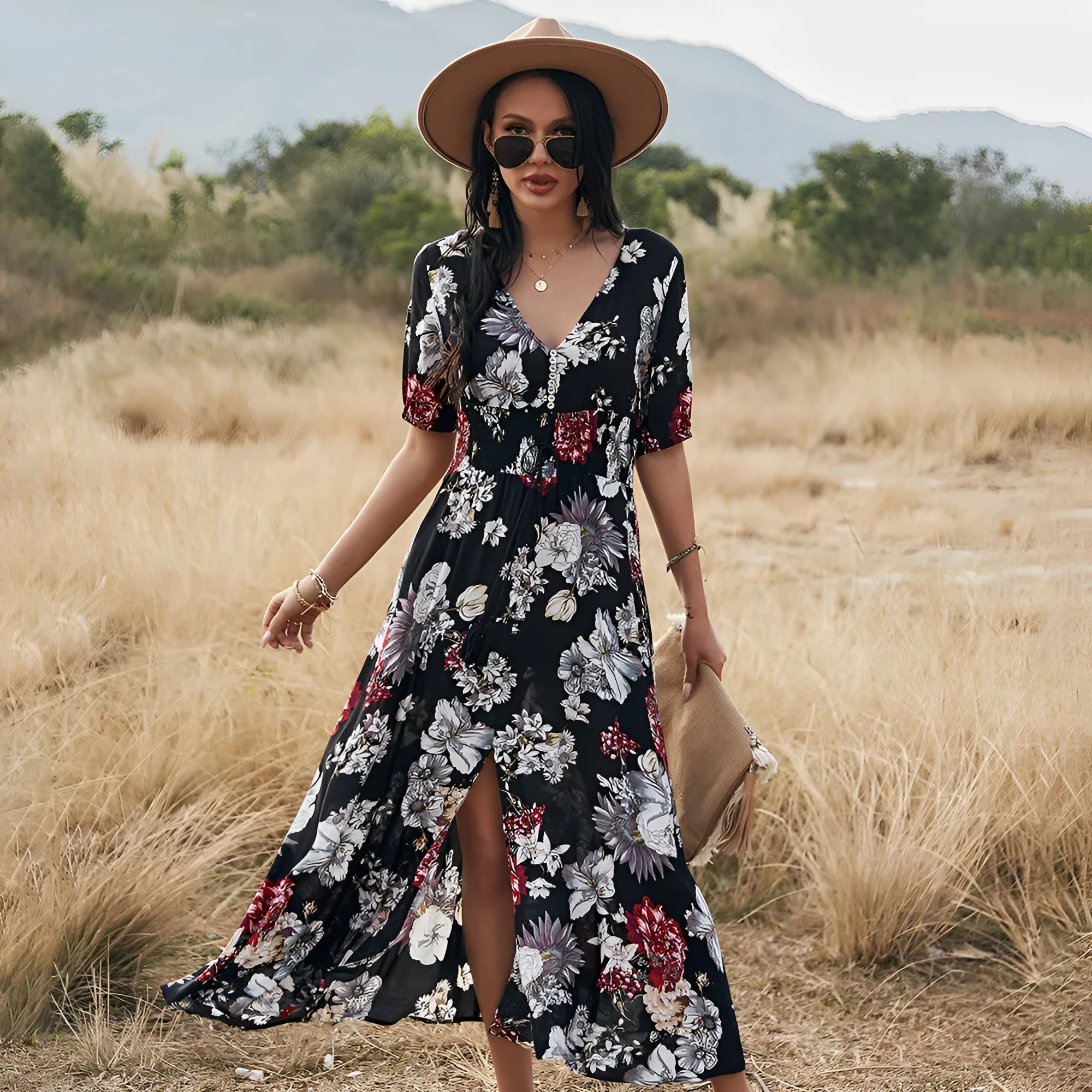 Yellow floral print women's dress with v-neck, short sleeves, elastic high waist, and a large hemline midi skirt.