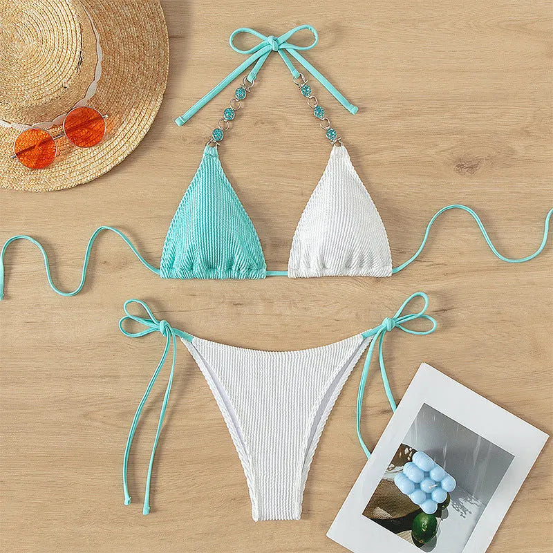Women's two-piece nylon swimsuit with front lace-up and pearl chain detail in a colour-matching design.