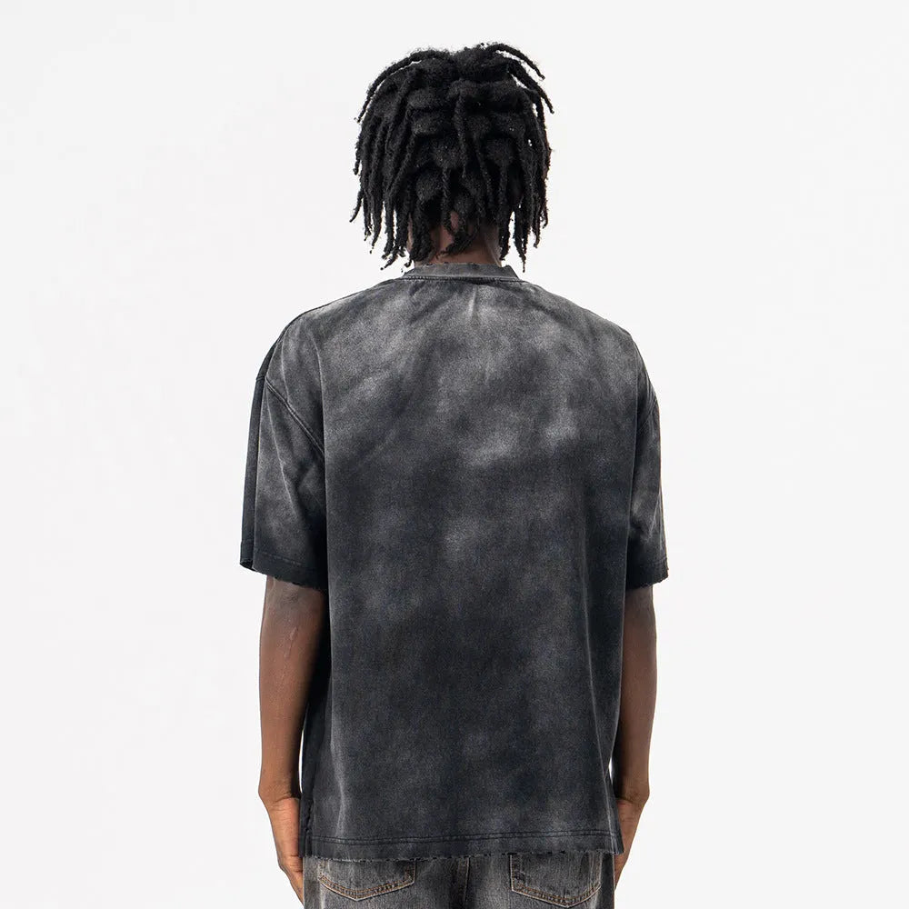 Black men's loose fit cotton t-shirt with drop-shoulder sleeves and a printed letter design on the front.