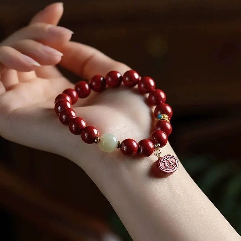 Cinnabar Emperor Sandstone bracelet with Ping An Fu Lu motifs in 8mm or 10mm bead sizes