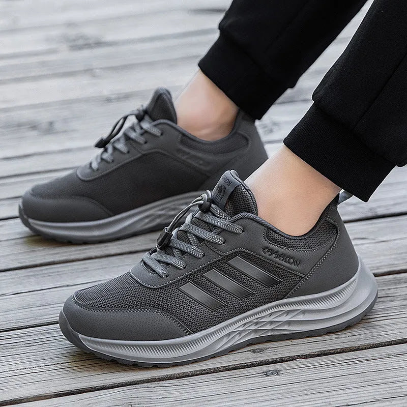 Men's and women's breathable mesh slip-on sneaker in black on a light background.