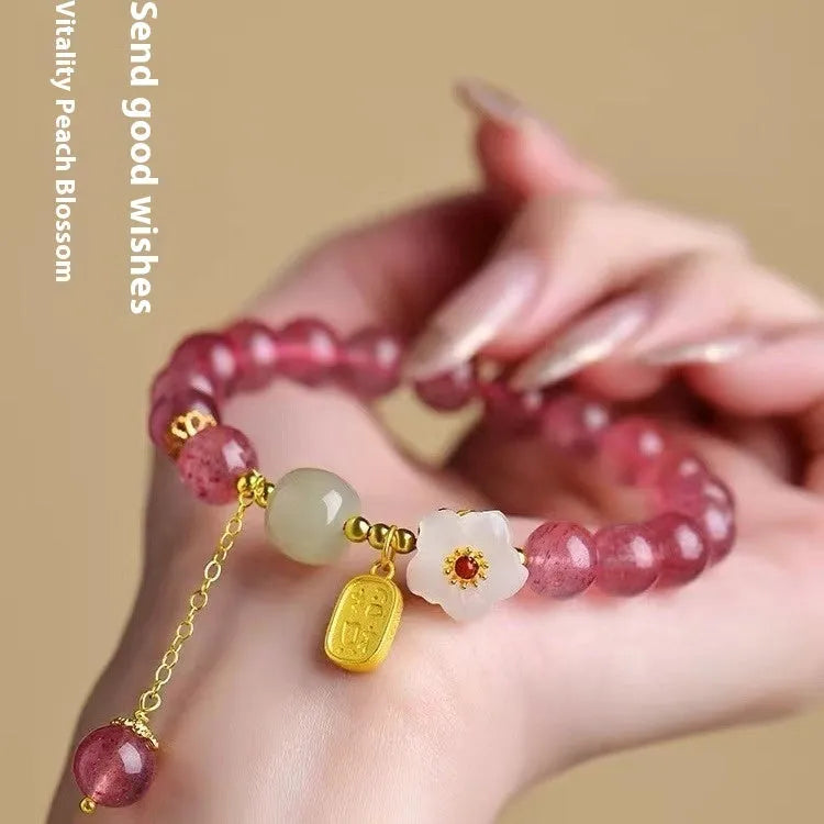 Handmade strawberry quartz crystal bracelet for women showing natural bead designs