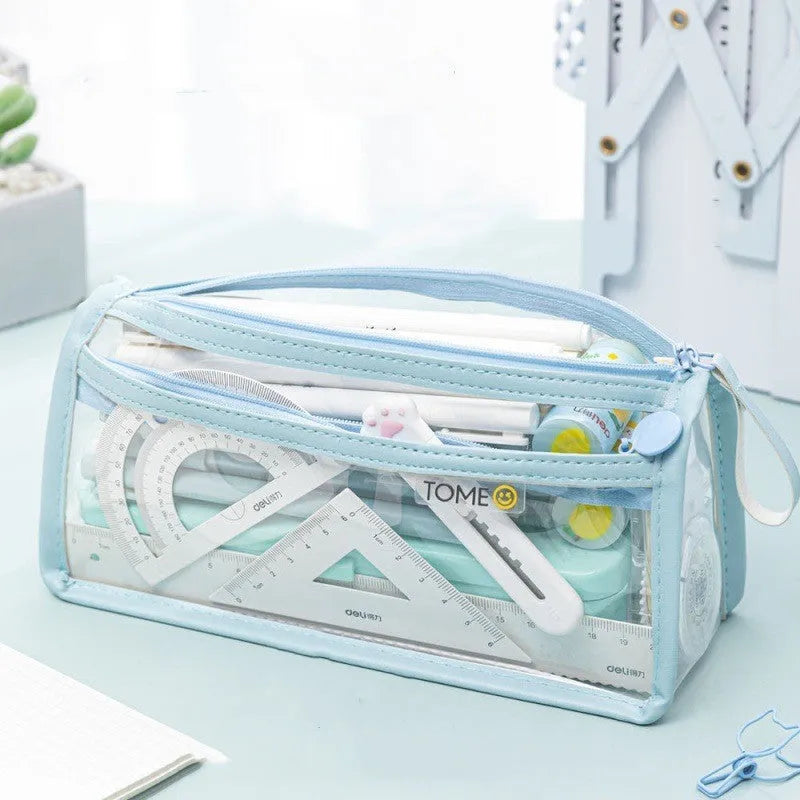 Double-layer transparent pencil case in beige, showing two separate compartments zipped open, with dimensions 220x110x80mm.