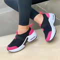 Women's white mesh sneakers with a rubber sole and round toe, shown on a light background.