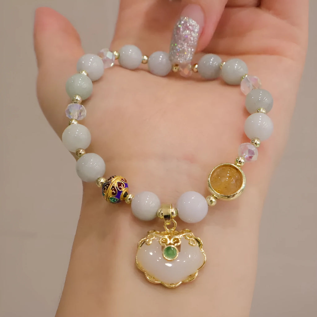 Geometric ethnic bracelet with natural jade, strawberry quartz stones and metal decorations