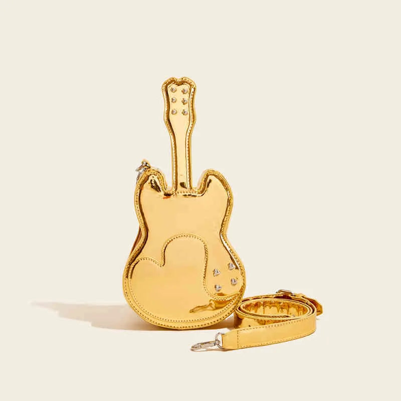 Guitar-shaped silver crossbody shoulder bag made from PU leather on a mannequin.