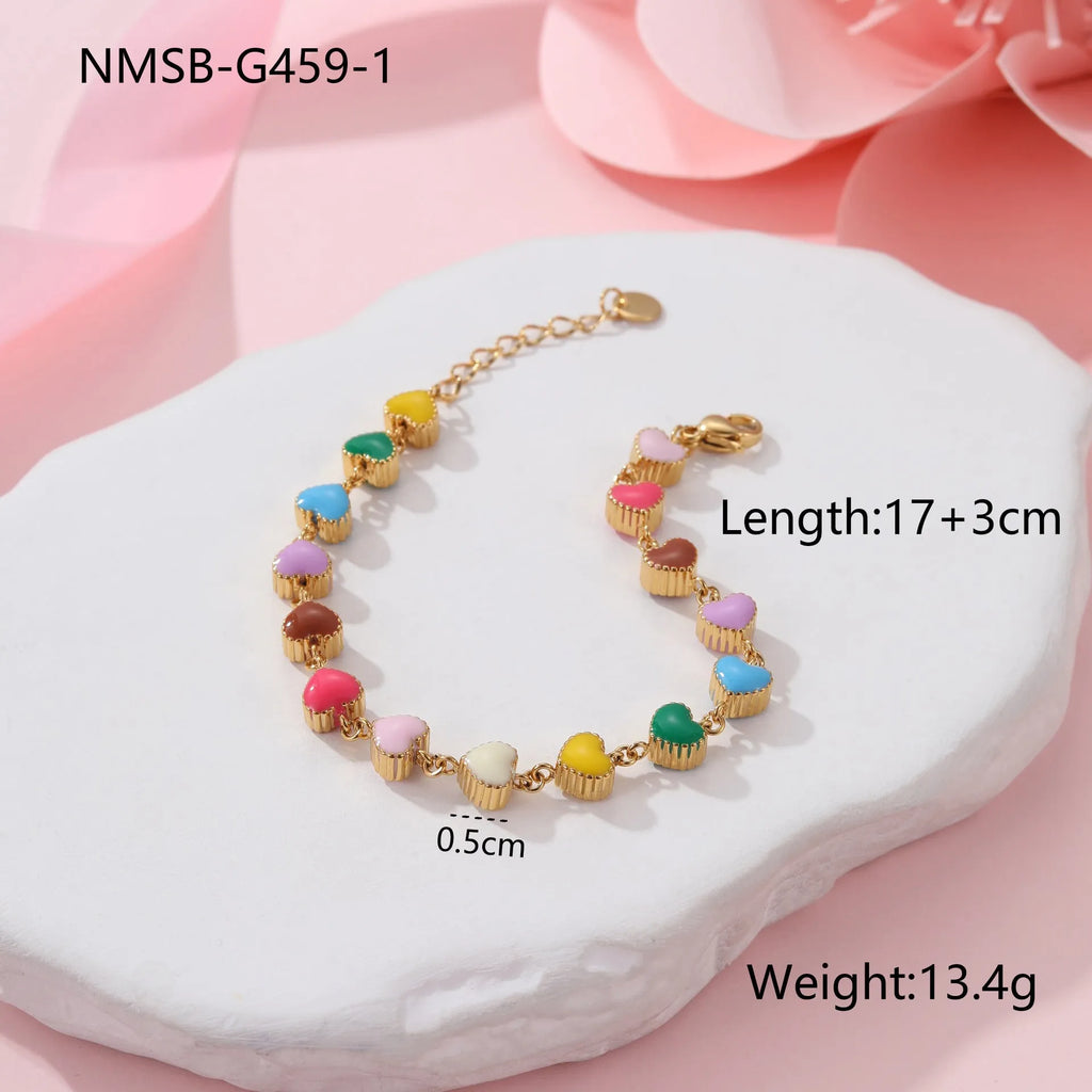 Women's stainless steel bracelet with love heart pendant in gold or steel finish
