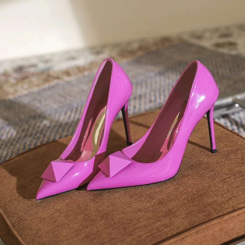 Pink patent leather pointed toe stiletto heels with buckle closure in three heel heights