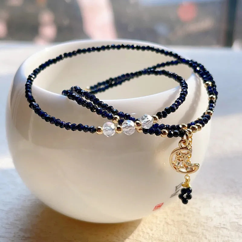 Close-up of a blue sandstone and gold multi-layer three-ring bracelet for women.