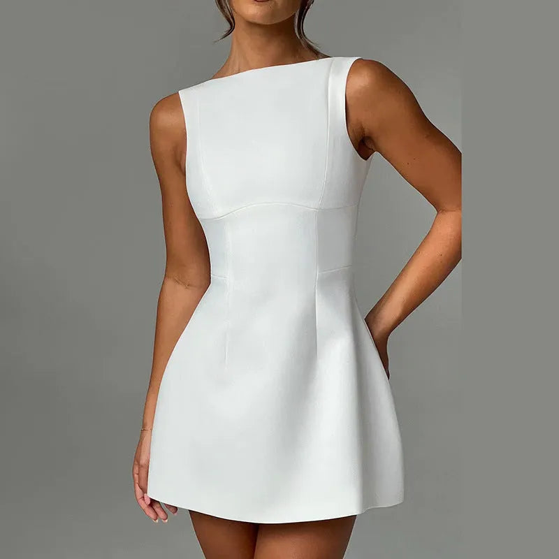 Slim-fitting backless sleeveless dress in polyester fabric, shown in a short length with a high waist.