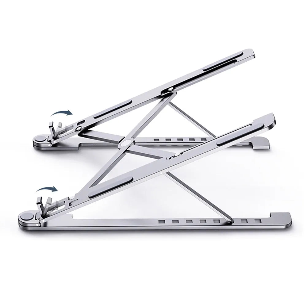 Aluminum foldable laptop stand in silver colour, shown adjusted to an elevated height with a laptop on top.