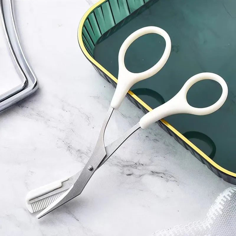 Curved moon eyebrow trimming knife with comb attachment in stainless steel and plastic