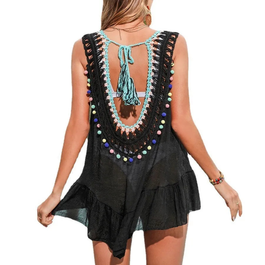 Black hand-crocheted acrylic women's beach cover-up with ruffled cut-out design and lining.