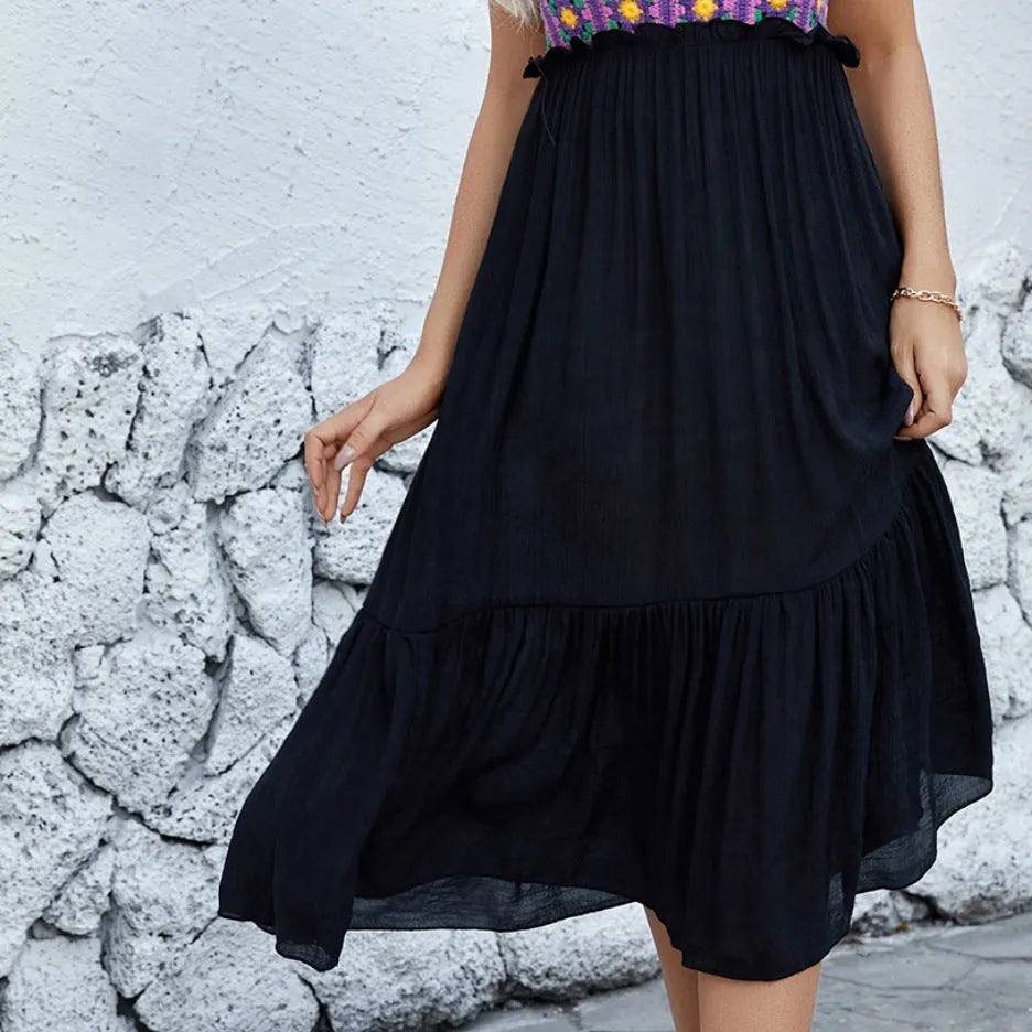 Purple sleeveless midi dress with white hand-hooked crochet floral pattern across the skirt.