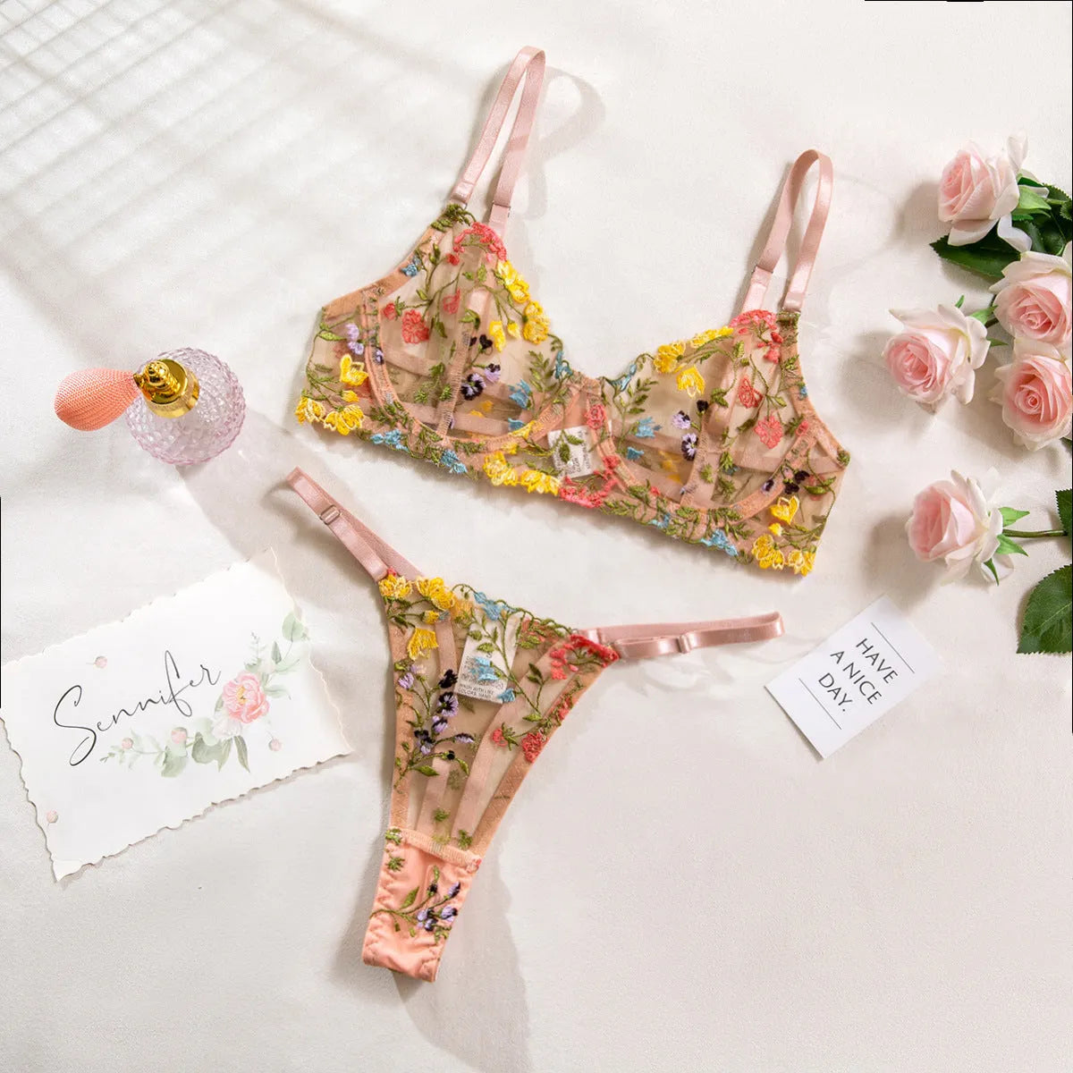 Floral pattern polyester mesh bra with steel ring T-back and matching brief in skin colour.