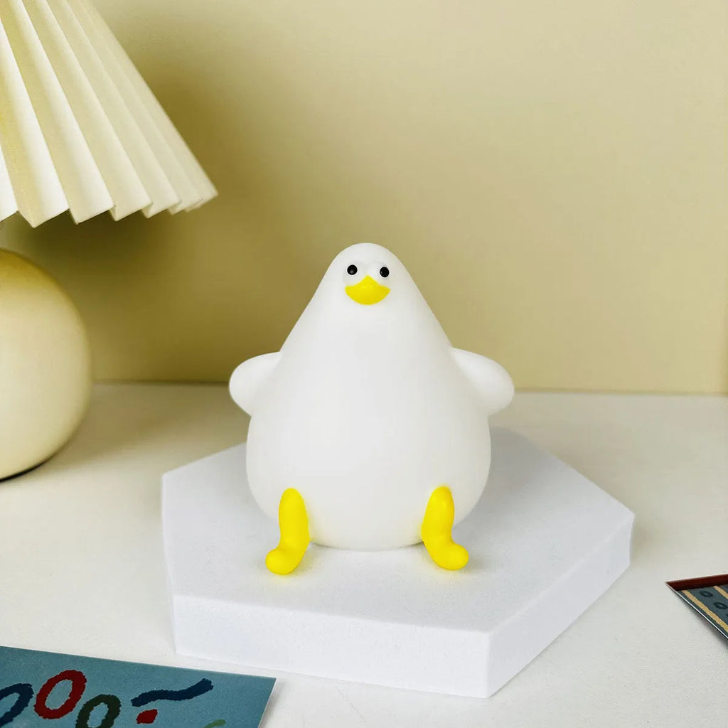 Cute cartoon silicone seagull night light USB rechargeable with soft glow on bedside table