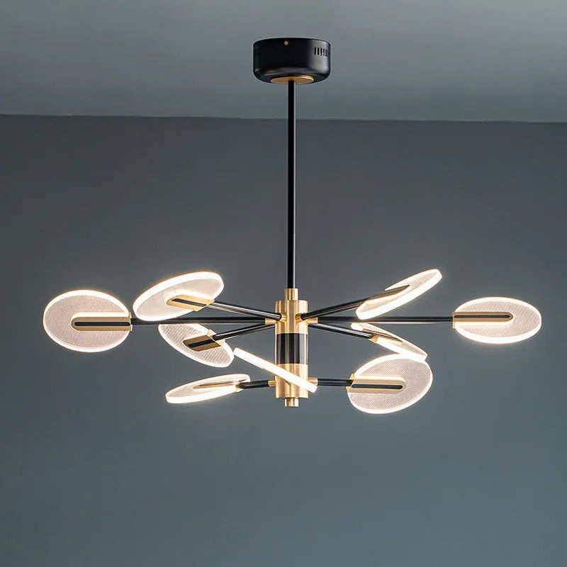 Nordic iron LED chandelier with acrylic elements hanging in a dining room setting