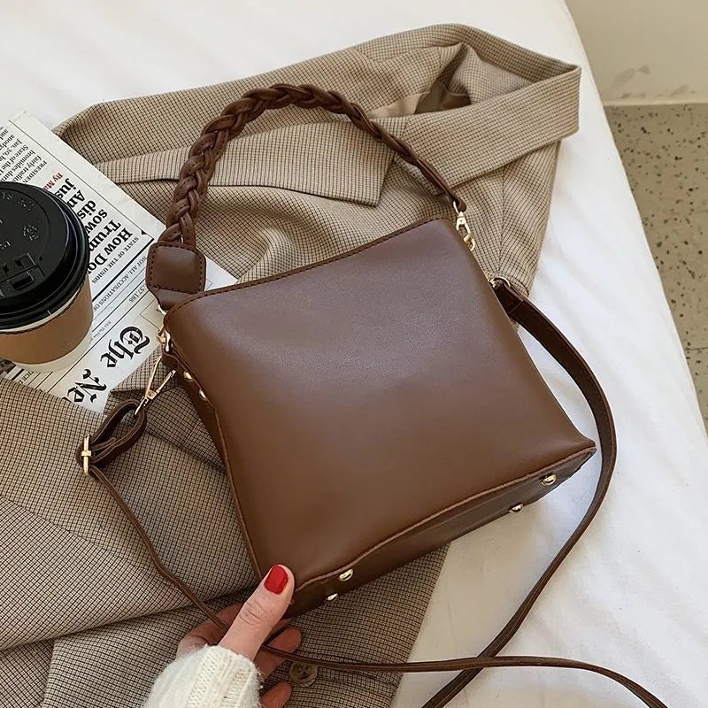 Retro style woven PU crossbody bucket bag in neutral colour