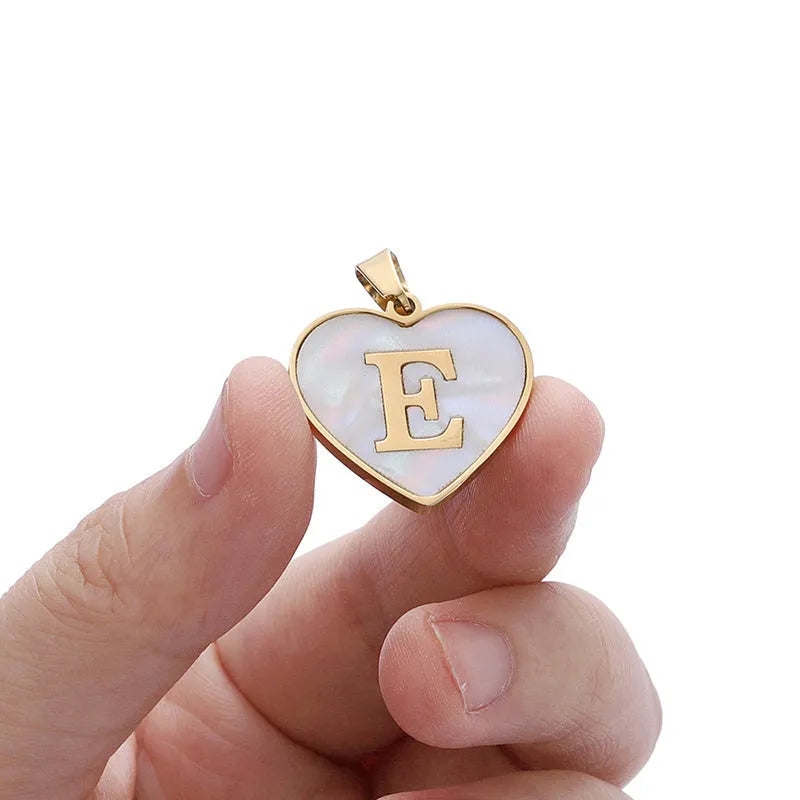 Gold plated heart pendant necklace with white shell centre and personalised letter engraving on adjustable chain