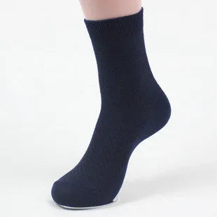 Men's bamboo fibre business socks in small square pattern, shown in classic colours on a grey background.