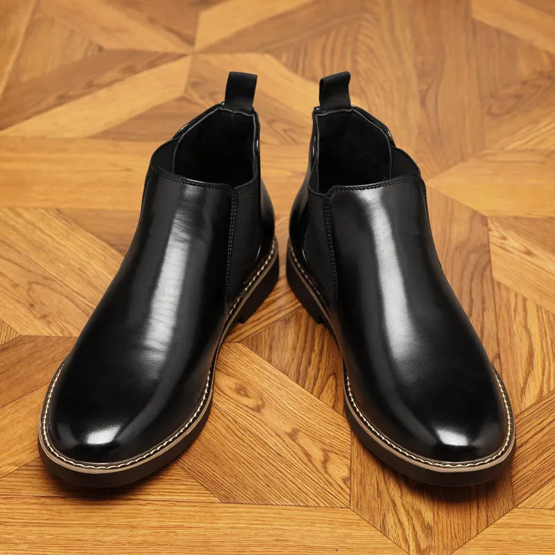 Black and brown formal pointed-toe leather boots with a square heel and rubber sole.