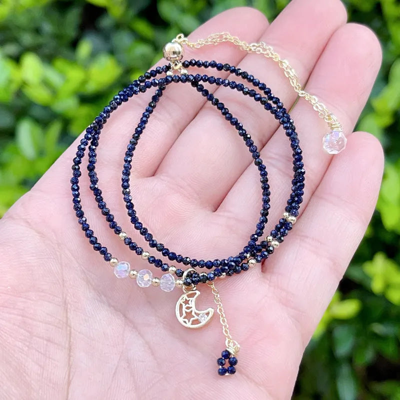 Close-up of a blue sandstone and gold multi-layer three-ring bracelet for women.