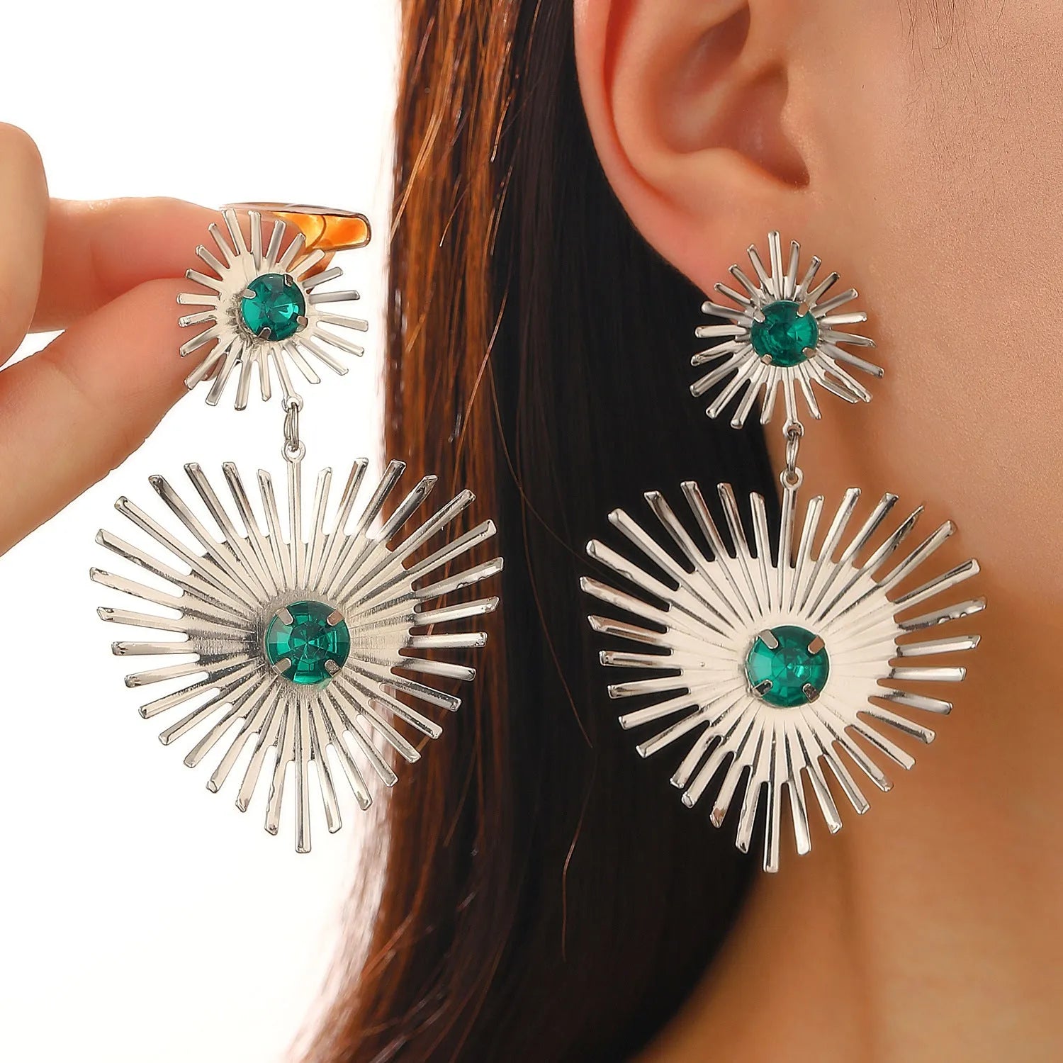 Alloy bohemian sunflower heart-shaped earrings with rhinestones in gold finish on white background