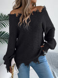 White hollow-out patterned long-sleeved sweater with a cut off-the-shoulder neckline on a model.