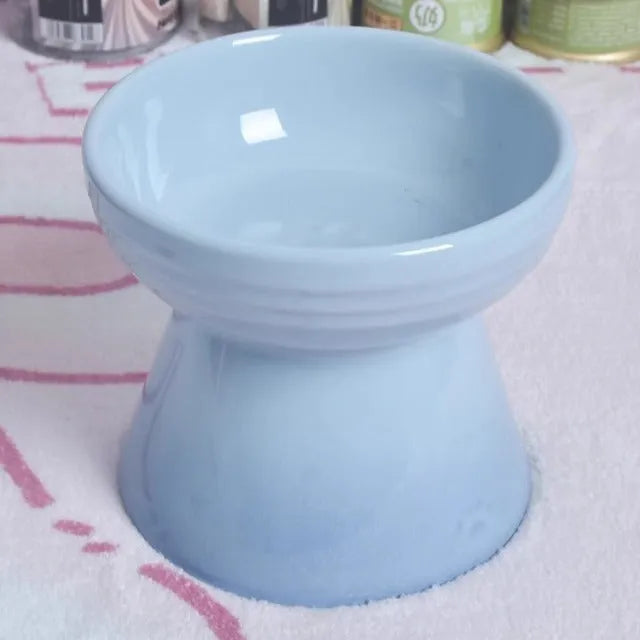 Ceramic pet bowl with high foot design showing anti-tumble stability feature