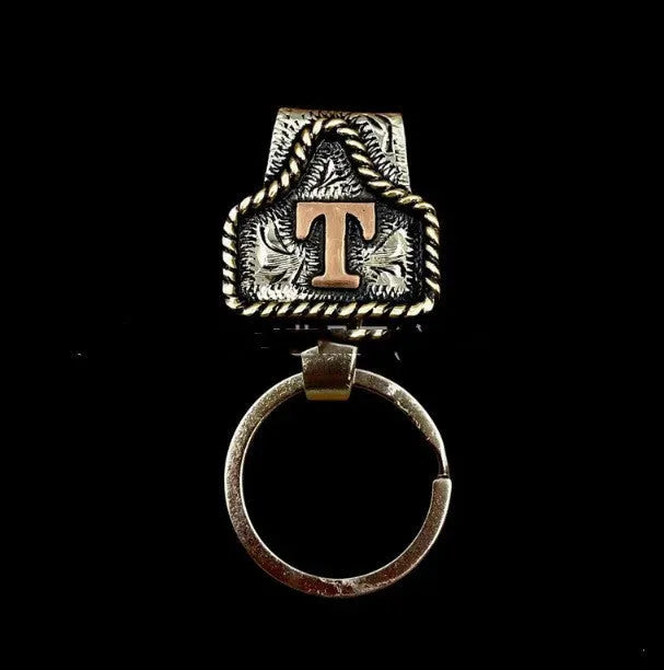 Handmade cow tag belt design metal keychain on a key ring