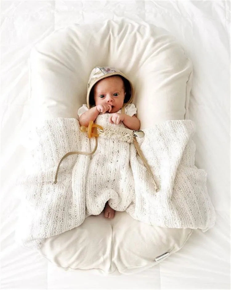 Portable baby nest crib measuring 75x45cm in cotton fabric with PP cotton filler
